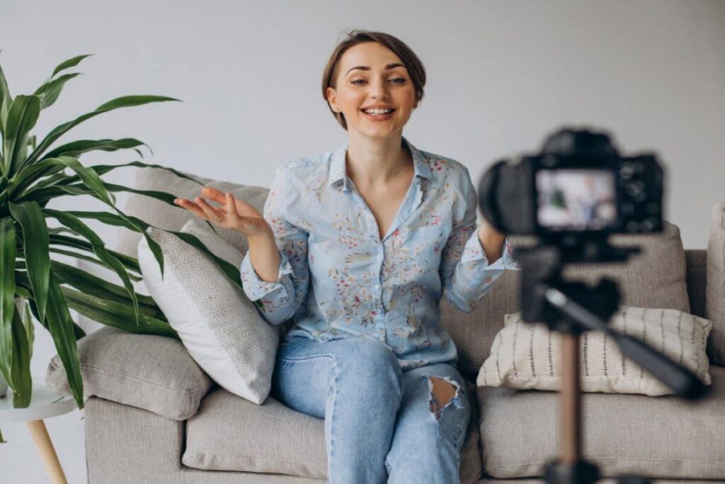 A woman speaking into a camera