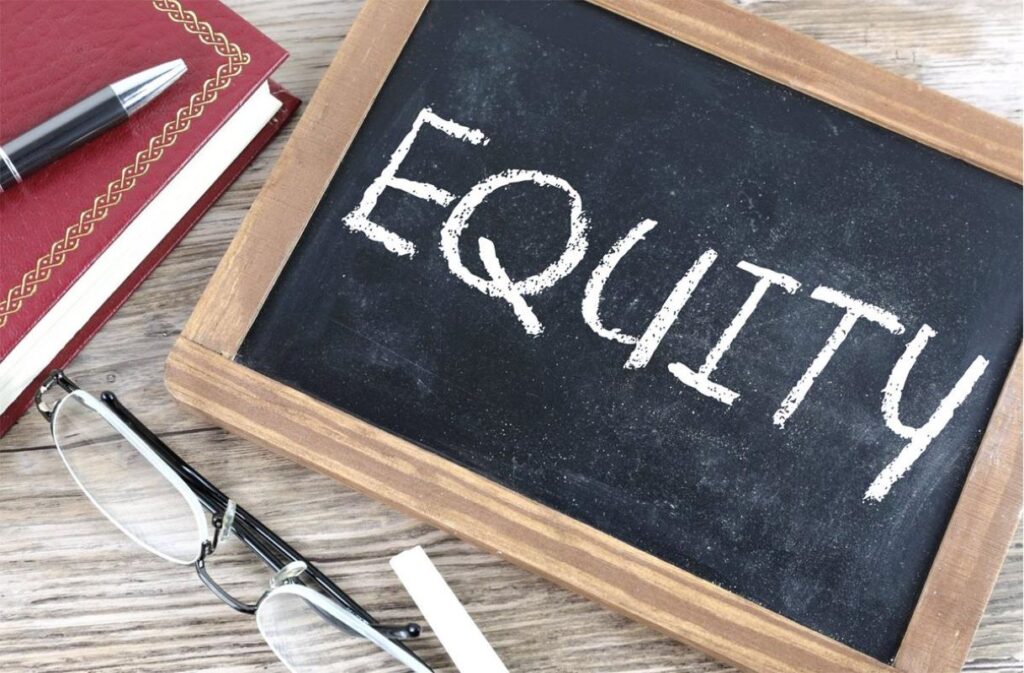 A chalkboard with ‘Equity’