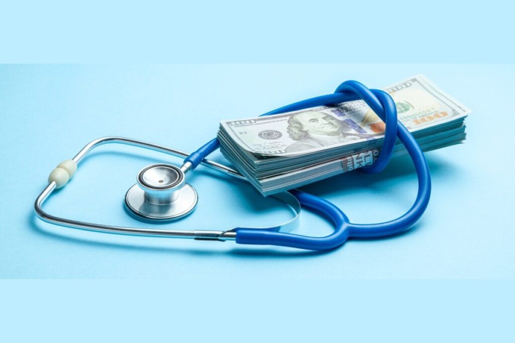 A stethoscope and a wad of cash