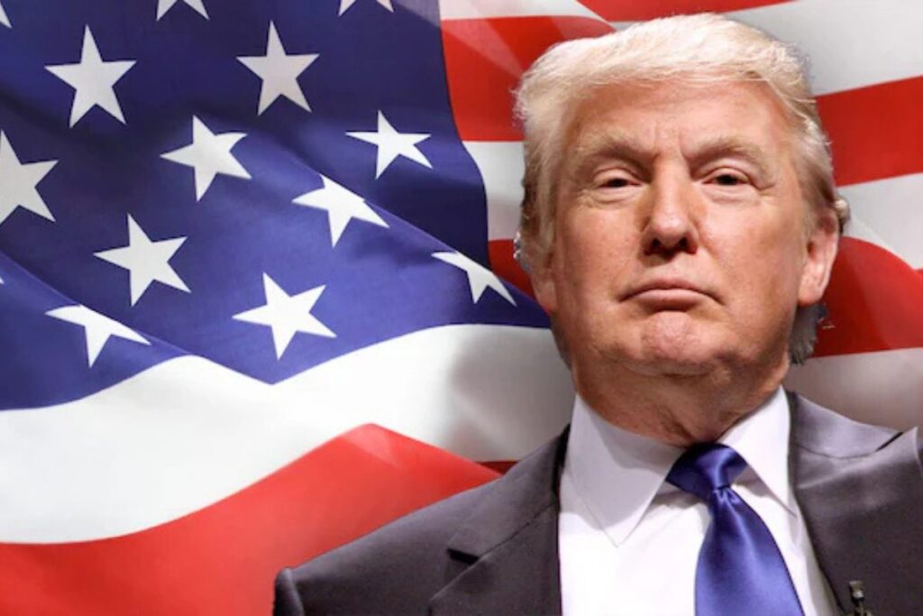 Trump by the American flag