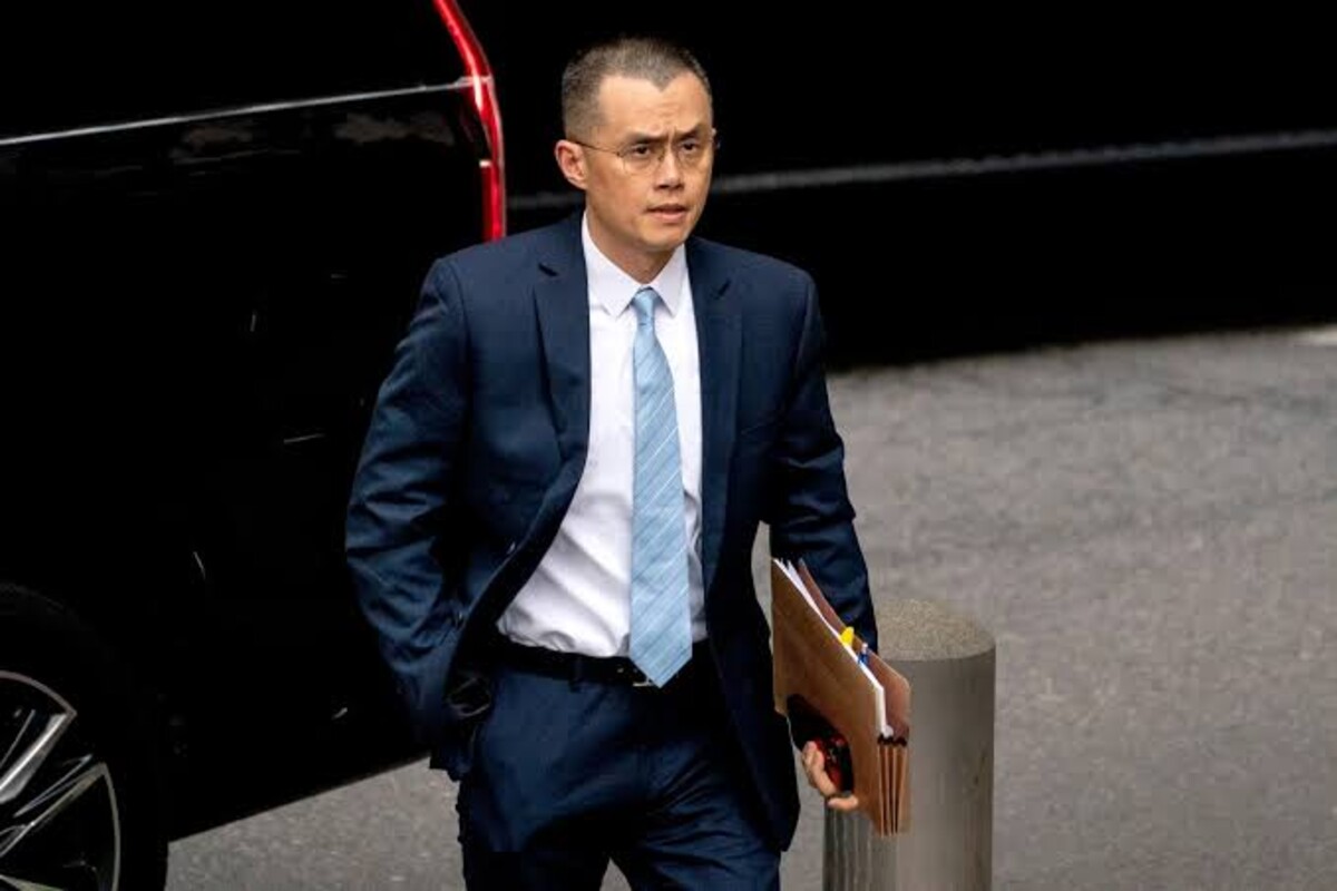 Former CEO Zhao walking towards a courtroom