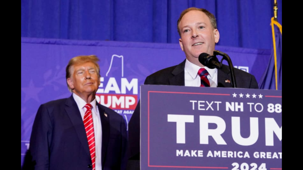 Donald Trump watching Lee Zeldin speak at his campaign rally