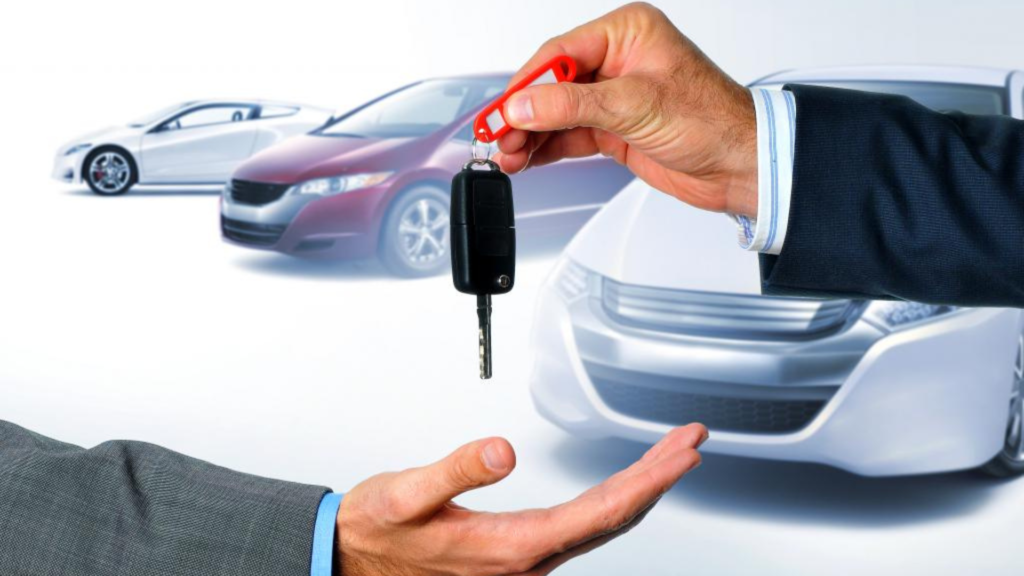 A Seller handing over car keys to a buyer