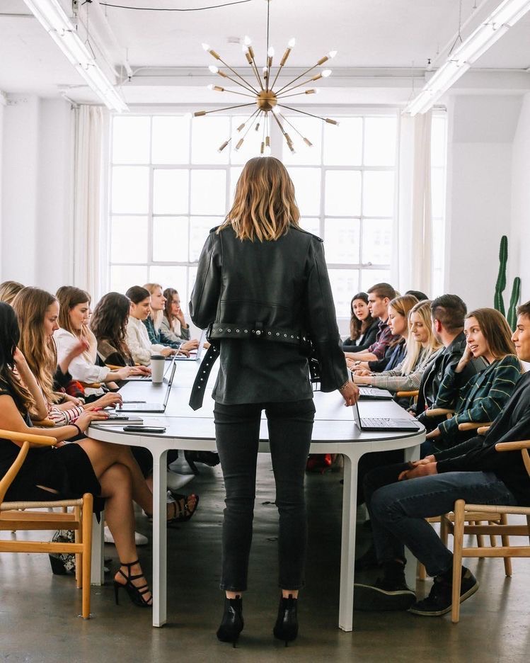 An image of people at an ongoing business meeting