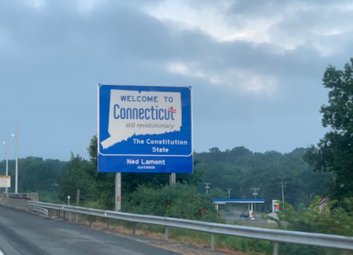 An image of a sign board saying welcome to Connecticut