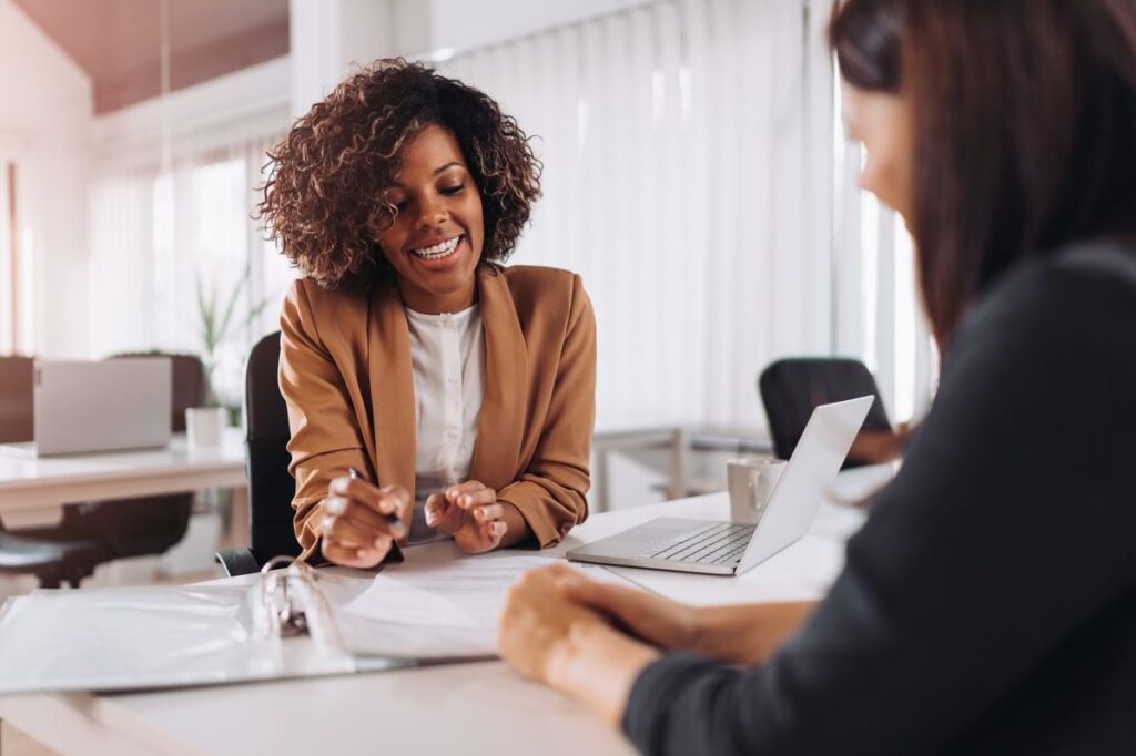 An image of two women working together