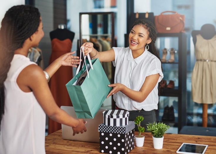 An image of a customer collecting goods at a checkout counter