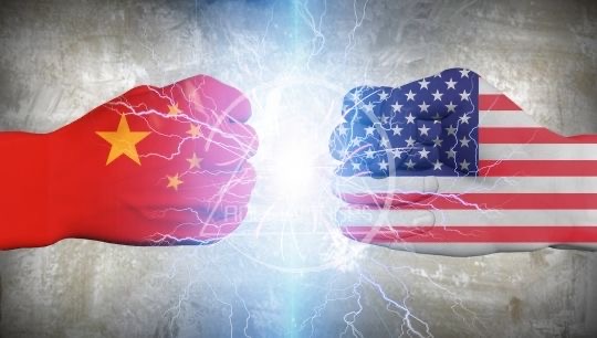 An image of two hands covered in Chinese and American flags