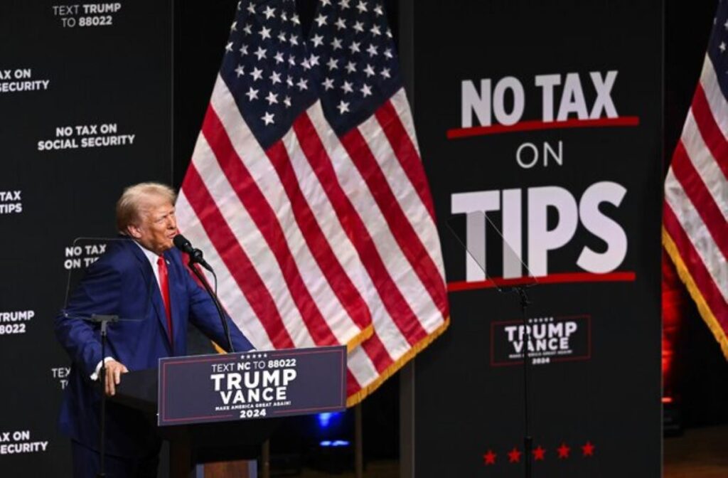 Trump addressing supporters at a campaign rally